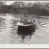 Weldon P. Smith, FSA (Farm Security Administration) supervisor, going out to the bayous and marshes to visit some of the muskrat trappers at their camps. Near Delacroix Island, Louisiana. See general caption number one.
