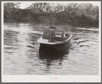 Weldon P. Smith, FSA (Farm Security Administration) supervisor, going out to the bayous and marshes to visit some of the muskrat trappers at their camps. Near Delacroix Island, Louisiana. See general caption number one.