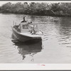 Weldon P. Smith, FSA (Farm Security Administration) supervisor, going out to the bayous and marshes to visit some of the muskrat trappers at their camps. Near Delacroix Island, Louisiana. See general caption number one.