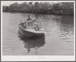 Weldon P. Smith, FSA (Farm Security Administration) supervisor, going out to the bayous and marshes to visit some of the muskrat trappers at their camps. Near Delacroix Island, Louisiana. See general caption number one.