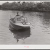 Weldon P. Smith, FSA (Farm Security Administration) supervisor, going out to the bayous and marshes to visit some of the muskrat trappers at their camps. Near Delacroix Island, Louisiana. See general caption number one.