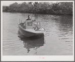 Weldon P. Smith, FSA (Farm Security Administration) supervisor, going out to the bayous and marshes to visit some of the muskrat trappers at their camps. Near Delacroix Island, Louisiana. See general caption number one.