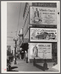 Billboards on side of building. New Orleans, Louisiana.