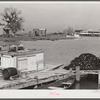 Trappers' and fishermen's boats and homes along the bayou. Delacroix Island, Louisiana.