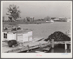 Trappers' and fishermen's boats and homes along the bayou. Delacroix Island, Louisiana.
