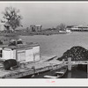 Trappers' and fishermen's boats and homes along the bayou. Delacroix Island, Louisiana.