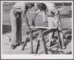 Measuring the top piece. Demonstration of home screen door construction. Saint Mary's County, Ridge, Maryland.