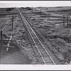 Railroad with grain elevators near Minot, North Dakota.