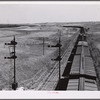 Freight train going west from Minot, North Dakota, across the plains.