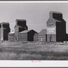 Building additional storage space for bumper wheat crop. Grain elevators in Homestead, Montana.