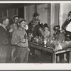 Spanish muskrat trappers have a round of drinks after each lot is sold at the fur auction held in a dance hall on Delacroix Island, Louisiana.