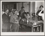 Spanish muskrat trappers have a round of drinks after each lot is sold at the fur auction held in a dance hall on Delacroix Island, Louisiana.