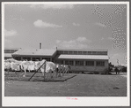 Utility building at Osceola migratory labor camp. Belle Glade, Florida.