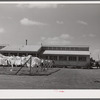 Utility building at Osceola migratory labor camp. Belle Glade, Florida.