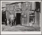 Living quarters, store, and "juke joint" for migratory laborers near Canal Point, Florida.