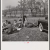Spectators picnicking before the Point to Point Cup race of the Maryland Hunt Club. Worthington Valley, near Glyndon, Maryland.
