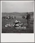 Man selling souvenirs, balloons, canes, etc., to the spectators at Point-to-Point Cup race. Worthington Valley, near Glyndon, Maryland.