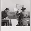 Bookie figuring out bets for Kentucky derby. Warrenton, Virginia.