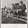 Spectators at paddock fence between races. Warrenton, Virginia.