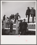 Spectators at paddock fence between races. Warrenton, Virginia.