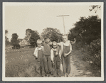 Louis Bennett (second left) and his friends. Cedar Street. East Hampton, East Hampton