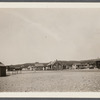 Montauk Railroad Station. A.J. Thomas residence on hill. Shack on left in foregroud is the new post office. East Hampton, East Hampton