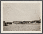 Montauk Railroad Station. A.J. Thomas residence on hill. Shack on left in foregroud is the new post office. East Hampton, East Hampton