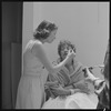 Jan Woodruff and unidentified others preparing for photo shoot