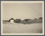 View. Hither Plains, Life Guard boat, Smith Cottage in center, Parsons Cottage on right. Montauk, East Hampton