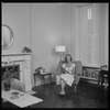 Unidentified woman seated with a cat
