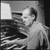 Unidentified man playing organ
