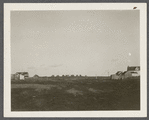 Dickerson Farmhouse (left). Next is Andrews House (center), Montauk Association Houses, Ditch Plains Life Savings Station on right looking east. Montauk, East Hampton