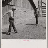 Dudes in the corral at Quarter Circle U, Brewster-Arnold Ranch Company. Birney, Montana.