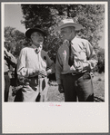 "Junior" Spear with a friend at stockmen's picnic and barbecue. Spear's Siding, Wyola, Montana.