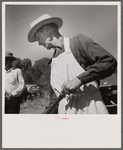 The chef barbecuing beef at the stockmen's picnic and barbecue. Spear's Siding, Wyola, Montana.