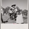 The chef barbecuing beef at the stockmen's picnic and barbecue. Spear's Siding, Wyola, Montana.