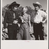 Spear's Siding, Wyola, Montana. Lyman Brewster of Quarter Circle U Ranch with Sally Rand and her father, Turk Greenough, at a stockmen's picnic and barbecue.