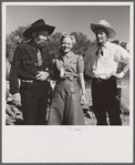 Spear's Siding, Wyola, Montana. Lyman Brewster of Quarter Circle U Ranch with Sally Rand and her father, Turk Greenough, at a stockmen's picnic and barbecue.