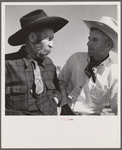 Lyman Brewster of Quarter Circle U Ranch with Turk Greenough's father (Sally Rand's father-in-law) at a stockmen's picnic and barbecue. Spear's Siding, Wyola, Montana.