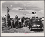 Ashland, Montana. Cowboys and spectators at the annual rodeo.