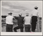 Cowboys and spectators at Ashland rodeo, Montana.