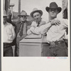Stockmen on street corner. Sheridan, Wyoming.