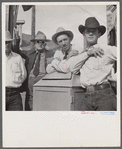 Stockmen on street corner. Sheridan, Wyoming.