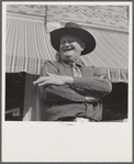 Stockman on street corner. Sheridan, Wyoming.