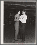 Dude dancing with cowhand on Saturday night in Birney, Montana.