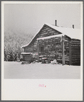 Ranch house after early fall blizzard in mountains near Aspen, Colorado.
