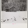 Cowhands' cabin on ranch after early fall blizzard in mountains near Aspen, Colorado.