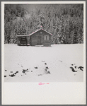 Cowhands' cabin on ranch after early fall blizzard in mountains near Aspen, Colorado.