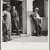 County judge with mortician and workman in front of mortuary. Main street of Leadville, old mining town, Colorado.