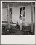 Children of family now living in old hotel in ghost mining town now coming to life because of defense needs. Montezuma, Colorado.